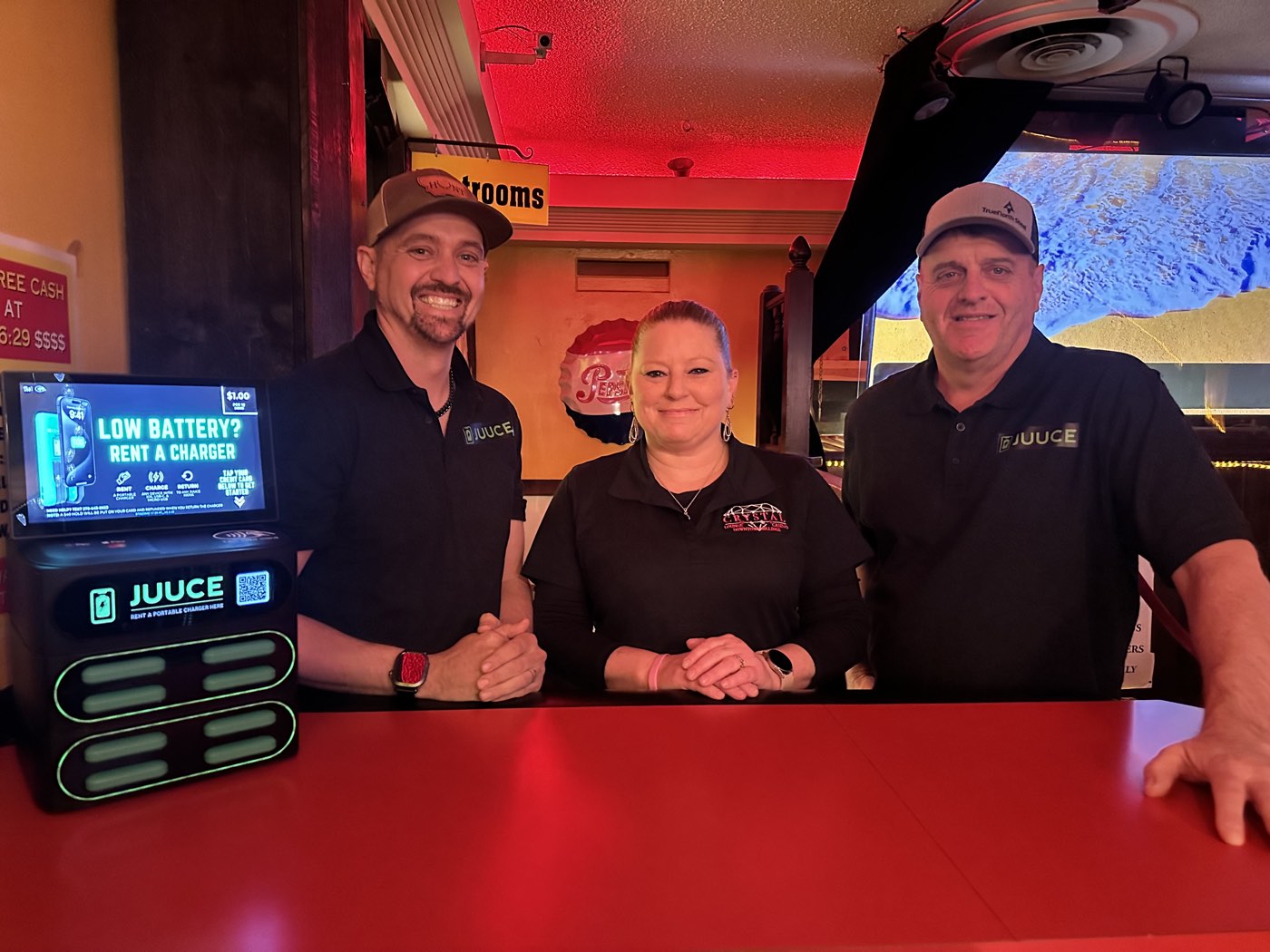 The team behind the bar at Crystal Lounge with their JUUCE station beside the register